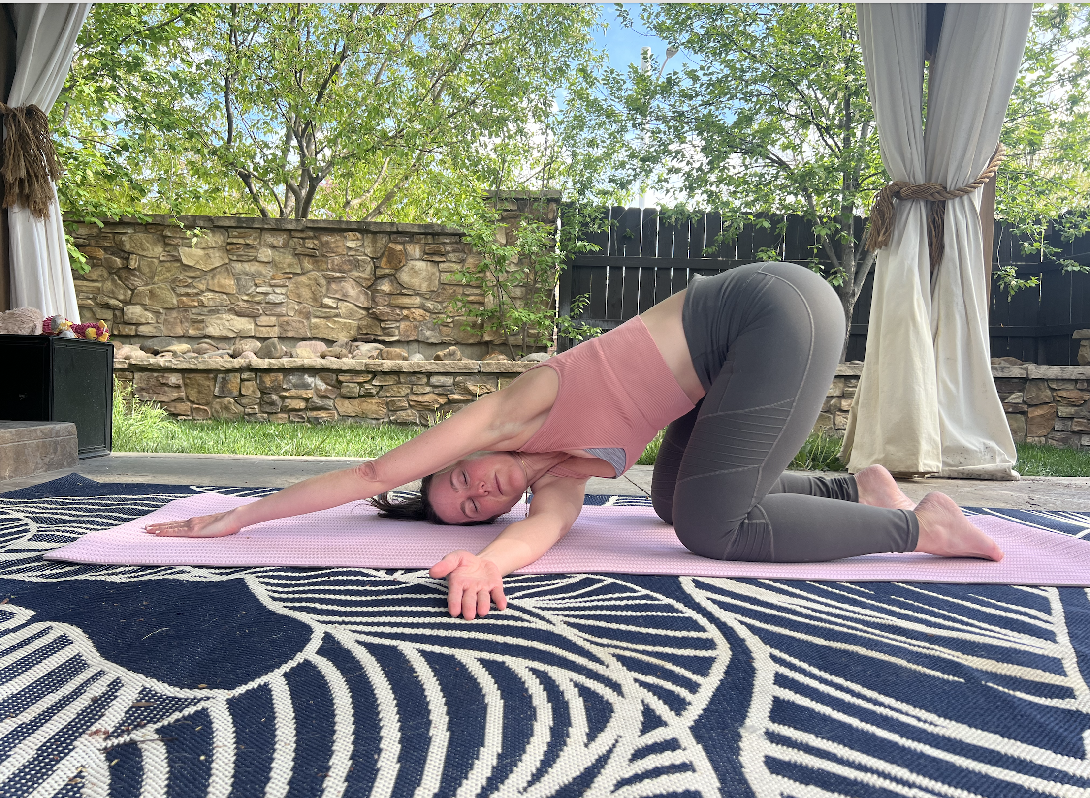 person doing thread the needle pose